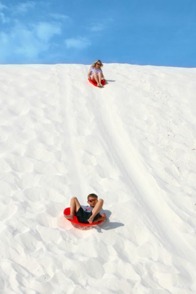 Noah sledding in White Sands
