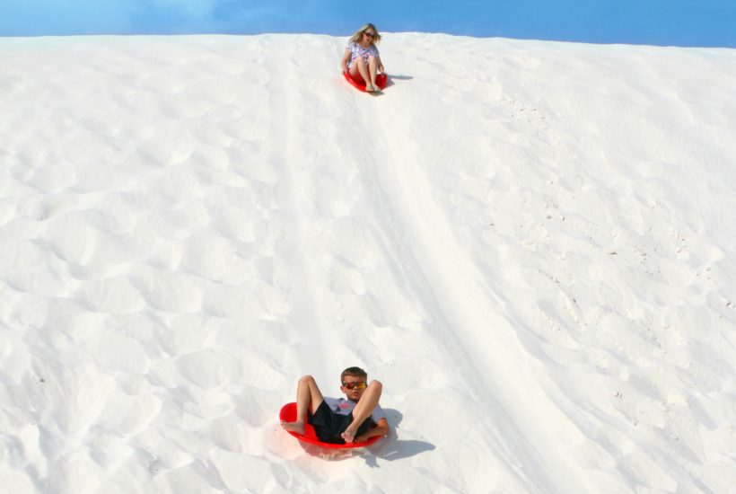 Noah sledding in White Sands