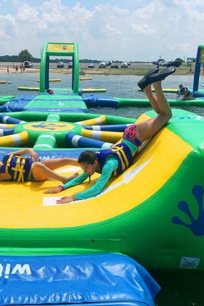 kids having fun on water inflatable