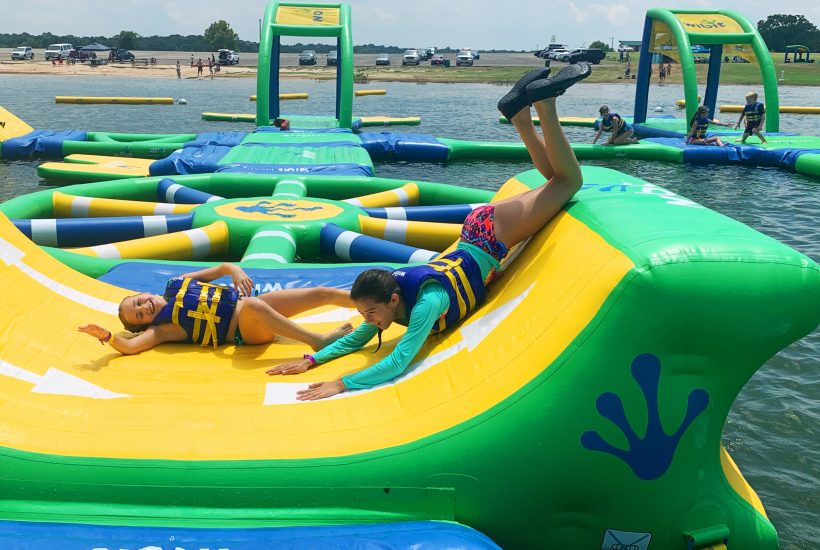 kids having fun on water inflatable