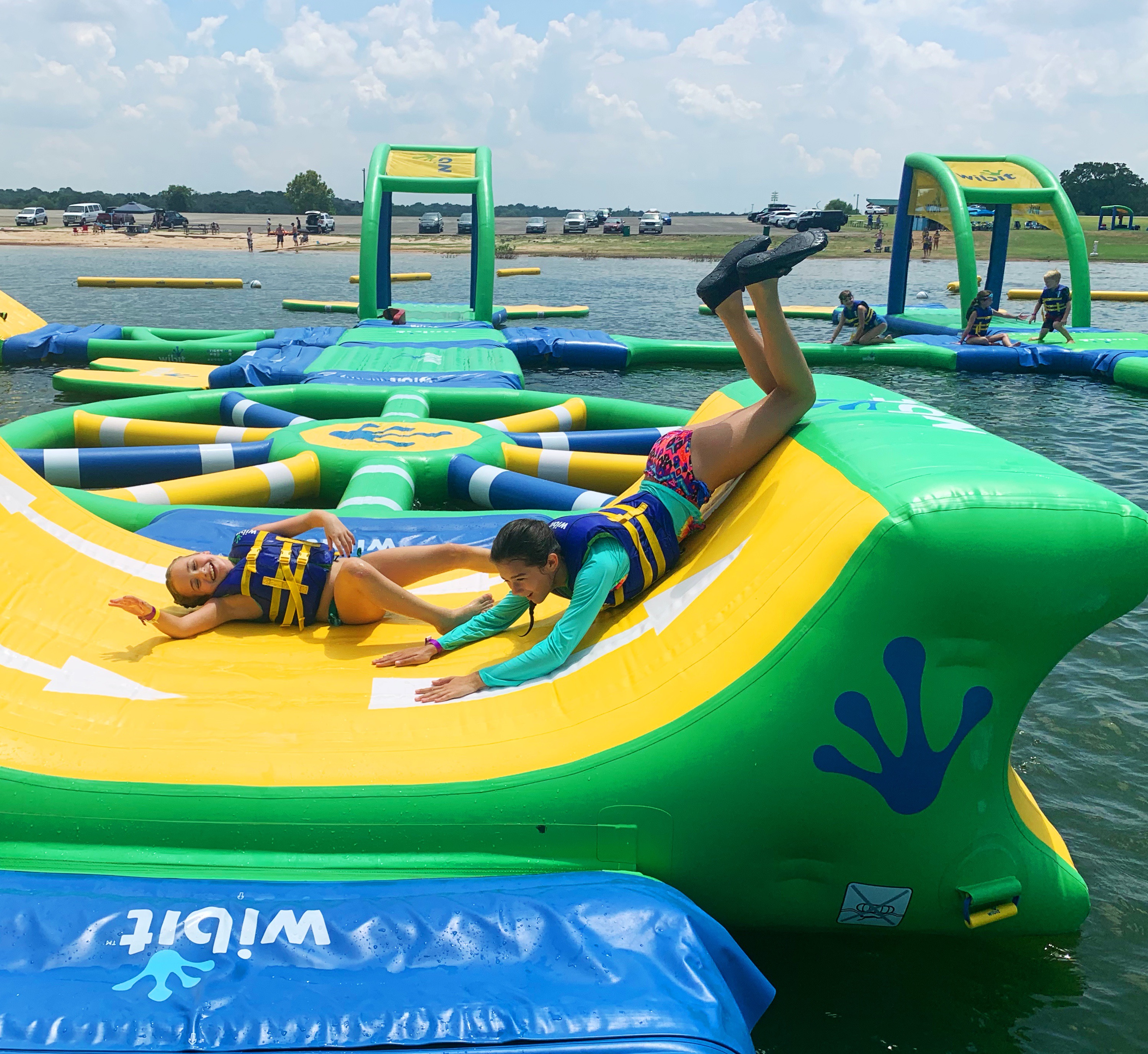 kids having fun on water inflatable